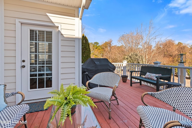 wooden deck featuring grilling area