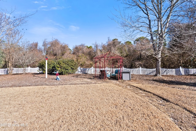 view of yard with a gazebo and a playground