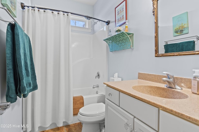 full bathroom with vanity, shower / bath combo, and toilet