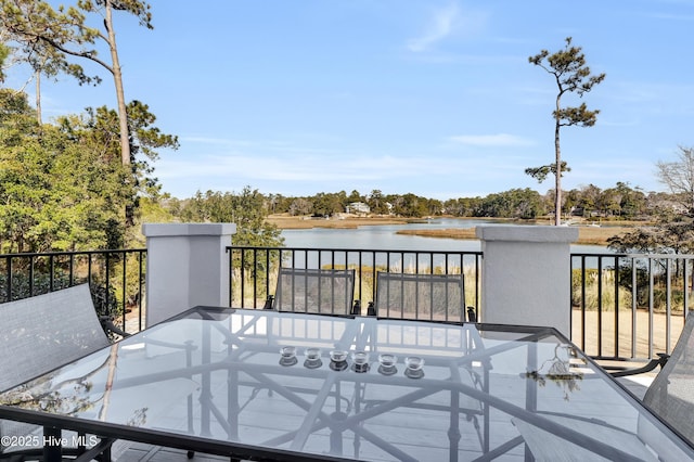 wooden deck featuring a water view