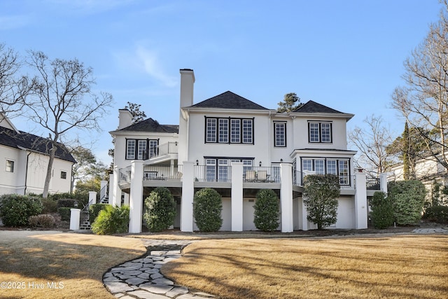 view of front facade featuring a front lawn and a deck