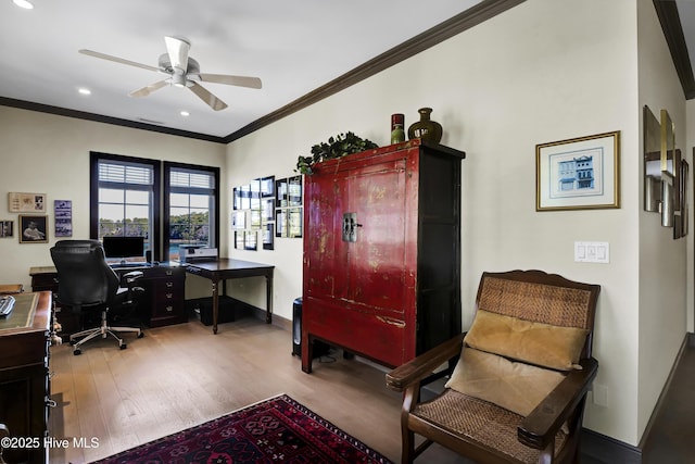 office area featuring crown molding, ceiling fan, and light hardwood / wood-style floors