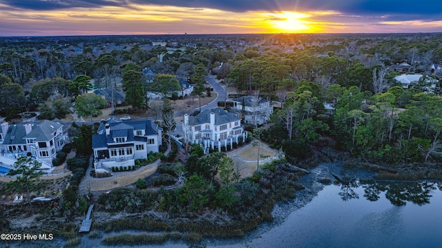 aerial view at dusk with a water view