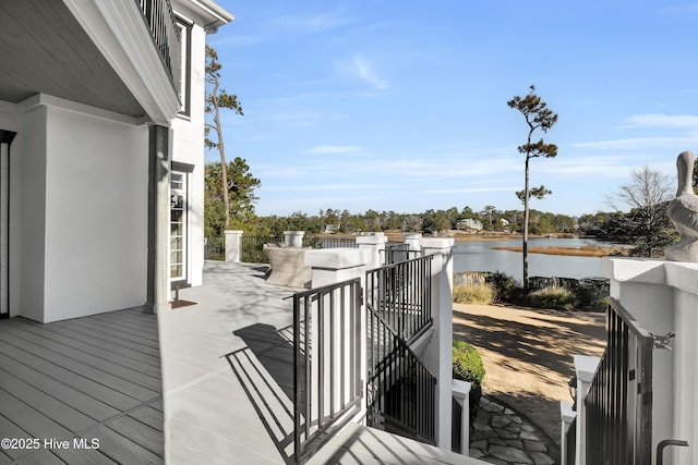 wooden terrace with a water view