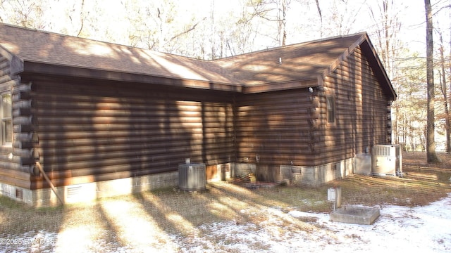 view of snow covered exterior with central air condition unit