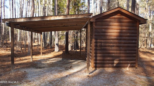 view of outbuilding featuring a carport