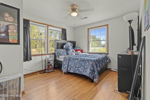 bedroom featuring ceiling fan and light hardwood / wood-style floors