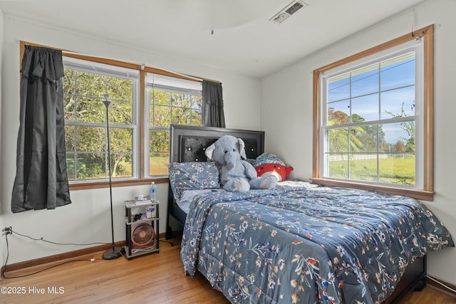 bedroom with hardwood / wood-style floors