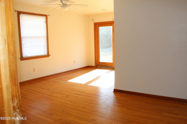 spare room featuring ceiling fan and hardwood / wood-style floors