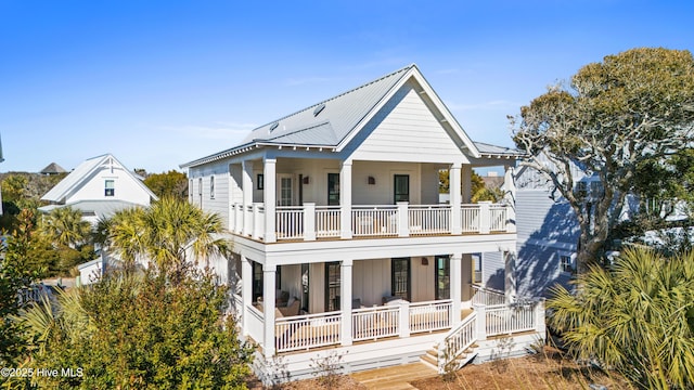 view of front of house featuring a balcony and a porch