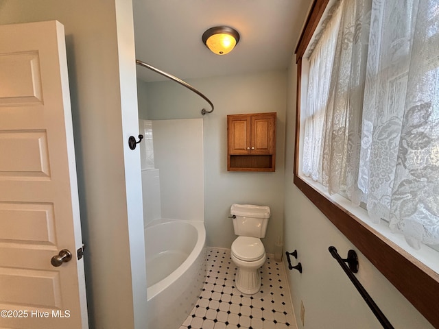 bathroom featuring tile patterned floors and toilet