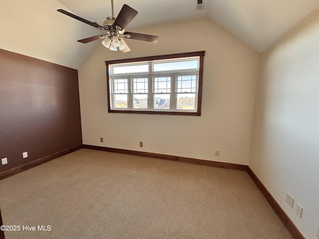 additional living space with ceiling fan, carpet floors, and vaulted ceiling