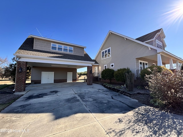 view of front of home featuring a carport