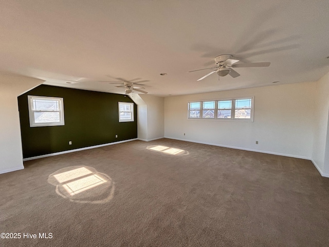 spare room with carpet floors and ceiling fan