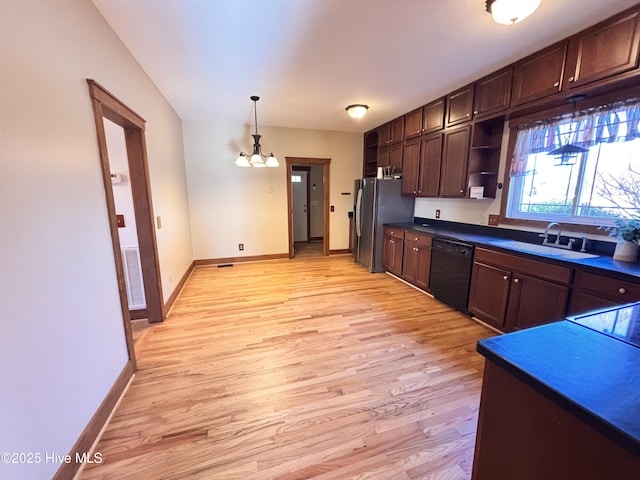 kitchen with sink, light hardwood / wood-style flooring, stainless steel fridge, dishwasher, and pendant lighting