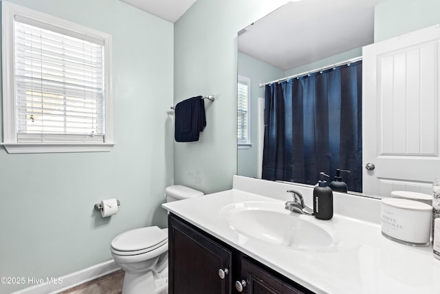 bathroom featuring vanity and toilet