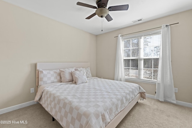 bedroom with light carpet and ceiling fan