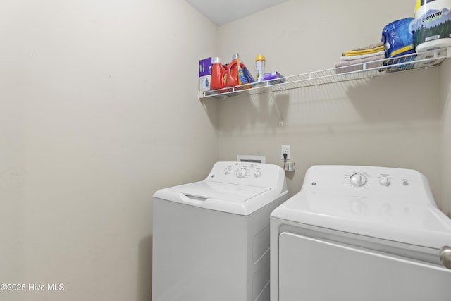 washroom featuring washer and dryer