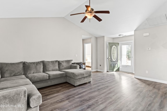 living room with hardwood / wood-style flooring, vaulted ceiling, and ceiling fan