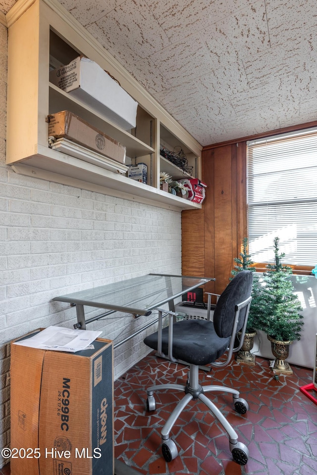 office area with wood walls