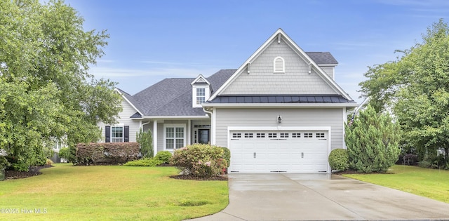 view of front of property featuring a garage and a front lawn