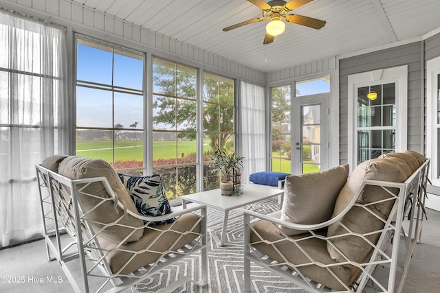 sunroom featuring ceiling fan