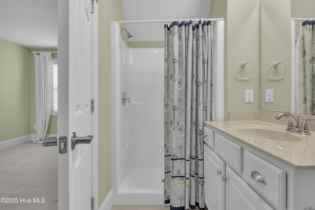 bathroom featuring vanity and a shower with shower curtain