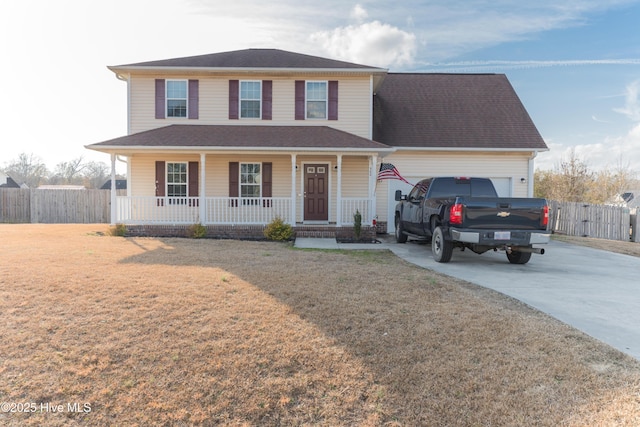 front of property with a porch, a garage, and a front yard