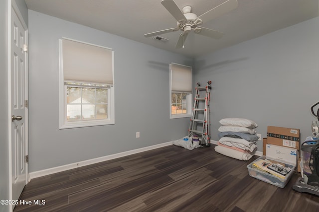 miscellaneous room featuring dark wood-type flooring and ceiling fan