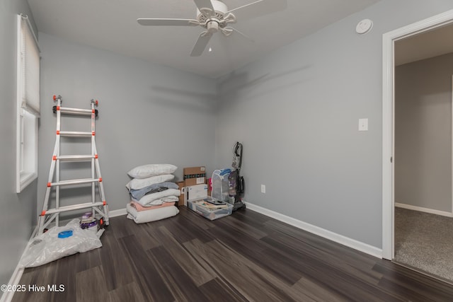 misc room featuring ceiling fan and dark hardwood / wood-style flooring