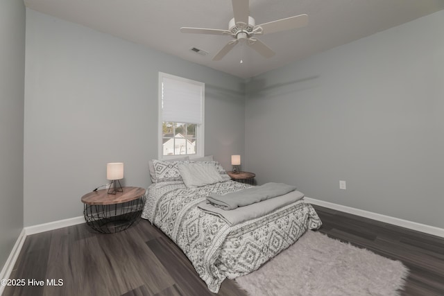 bedroom featuring ceiling fan and dark hardwood / wood-style flooring