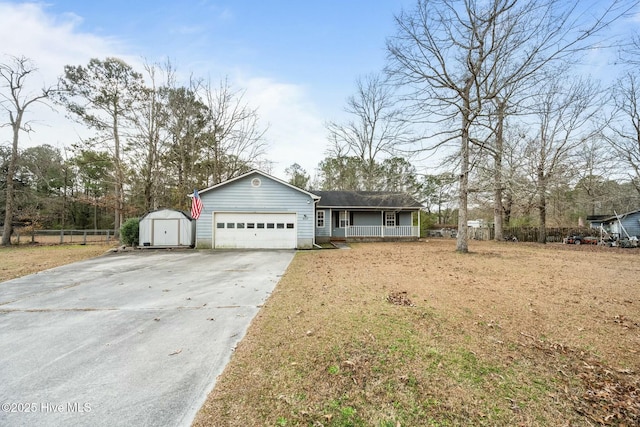 view of front of house with a porch, a garage, and a front yard