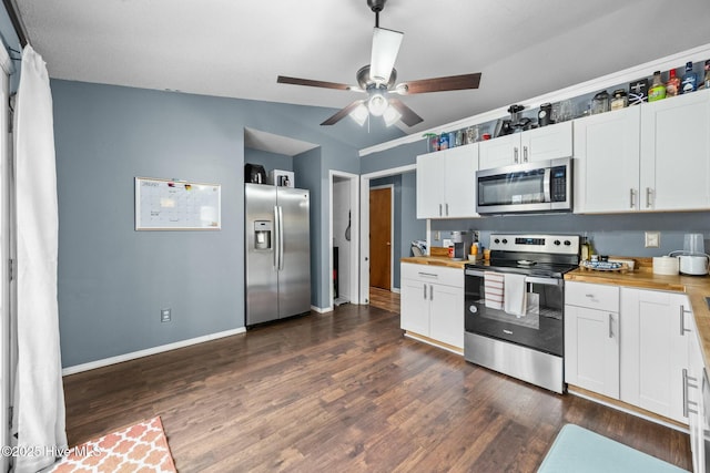 kitchen featuring white cabinetry, appliances with stainless steel finishes, dark wood-type flooring, and wood counters