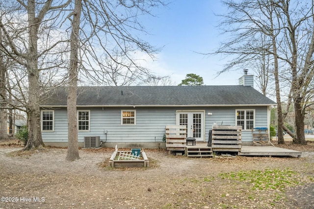 back of property with a deck and central air condition unit