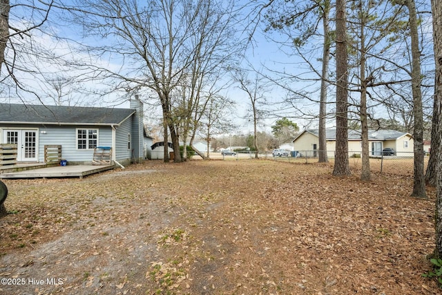 view of yard with a wooden deck