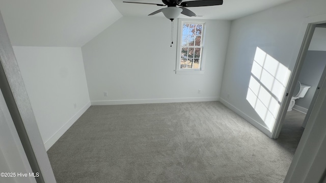 bonus room featuring lofted ceiling, carpet, and ceiling fan