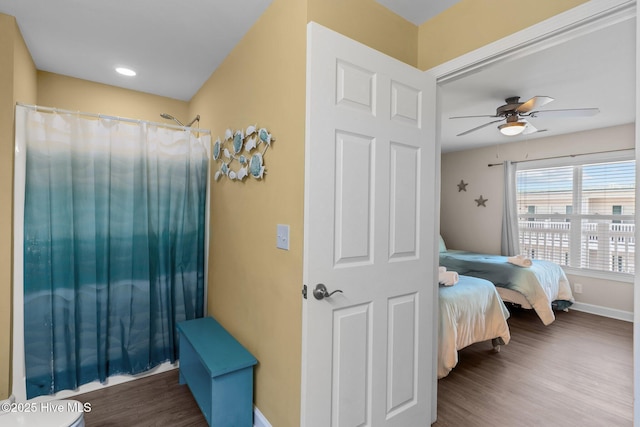 bedroom with wood-type flooring and ceiling fan