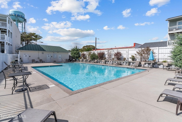 view of pool featuring a patio