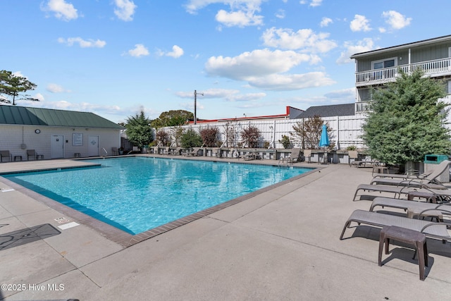 view of swimming pool featuring a patio area