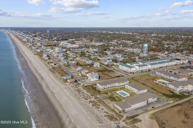 bird's eye view featuring a water view and a beach view