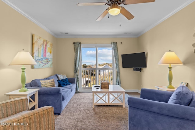 living room with ceiling fan and ornamental molding