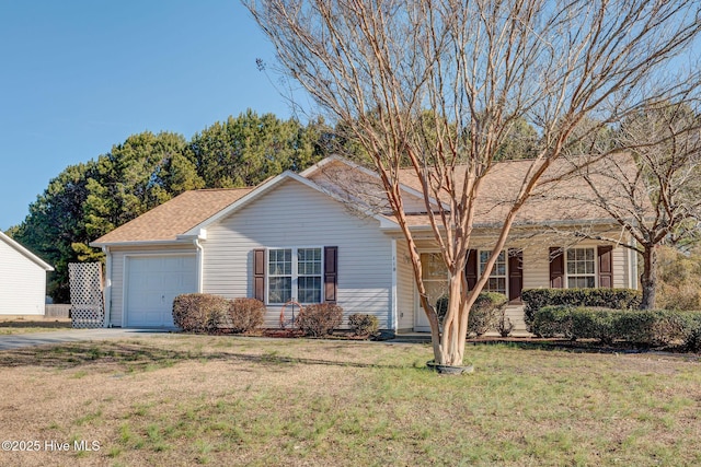 ranch-style home featuring a garage and a front yard