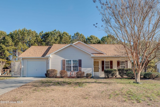 ranch-style home with a garage and a front lawn