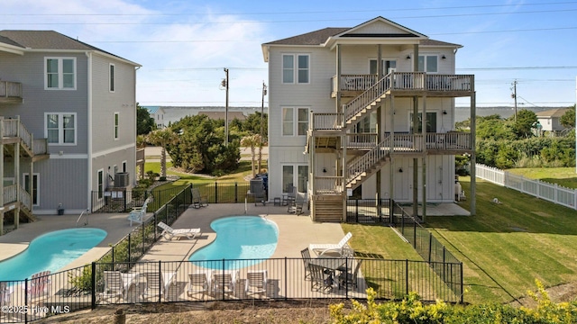 1903 Emerald Dr, Emerald Isle, NC 28594 - back of property featuring stairs, a wooden deck, and a patio