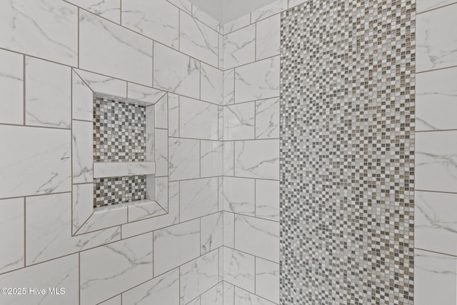 bathroom with a tile shower