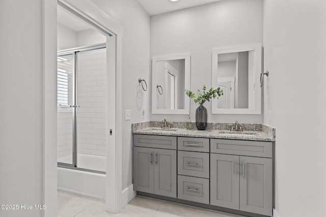 bathroom with vanity, tile patterned flooring, and enclosed tub / shower combo