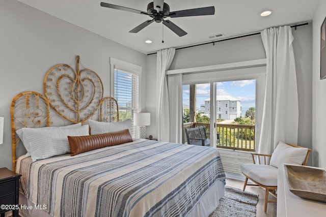 bedroom featuring access to exterior, hardwood / wood-style flooring, and ceiling fan