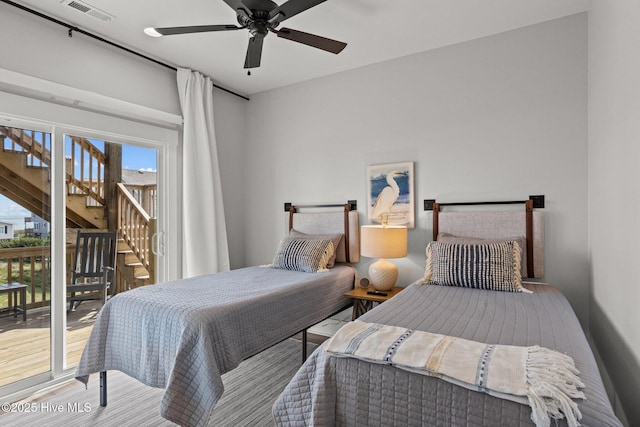 bedroom featuring wood-type flooring, access to exterior, and ceiling fan