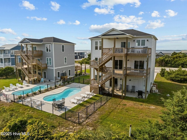 1903 Emerald Dr, Emerald Isle, NC 28594 - back of property featuring stairway, ceiling fan, a patio area, a wooden deck, and a balcony