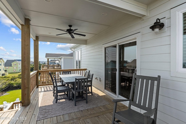 wooden terrace featuring ceiling fan